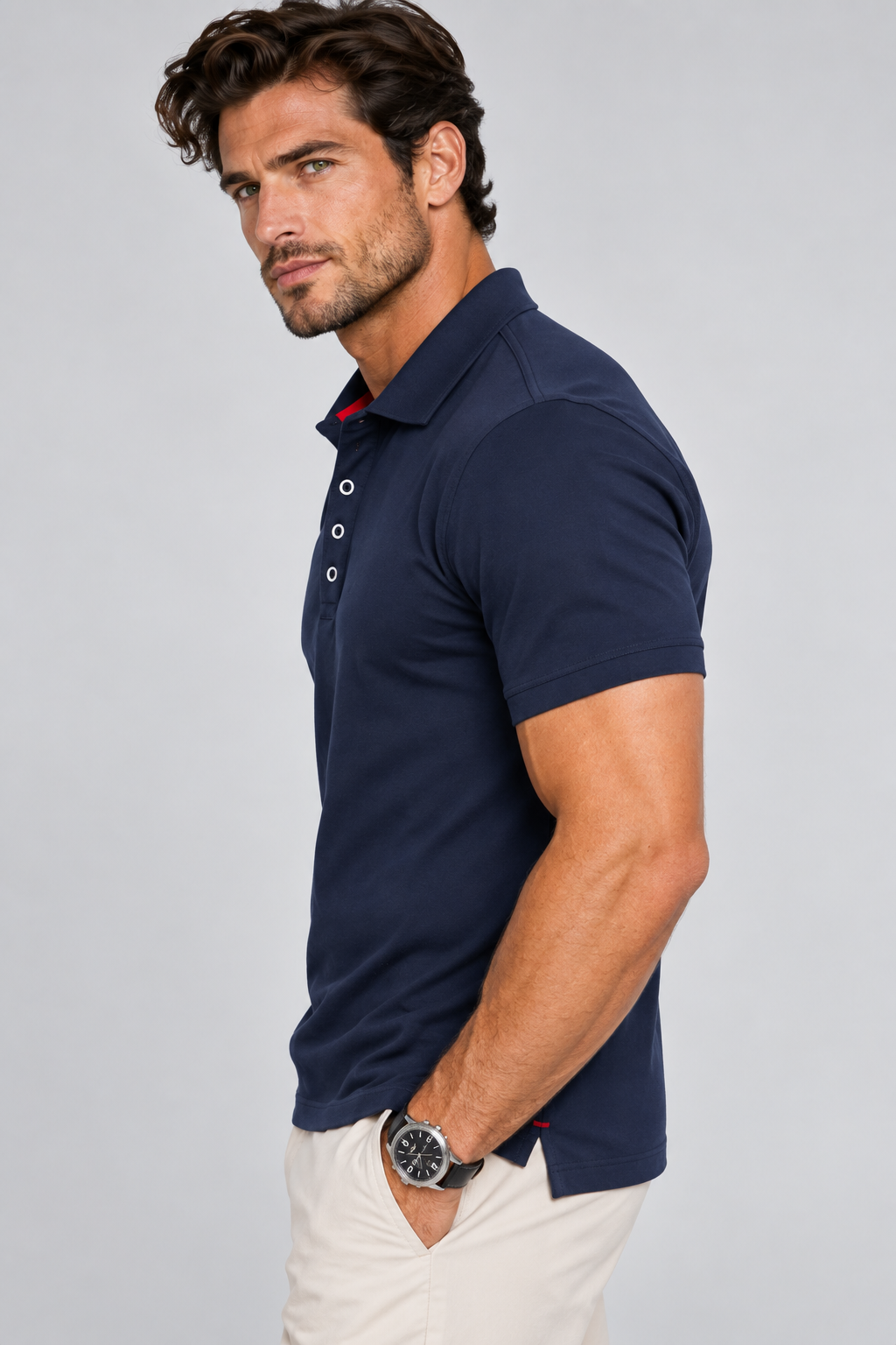 Man wearing  a Buki Cinqo Polo in Nav Side view in the studio L