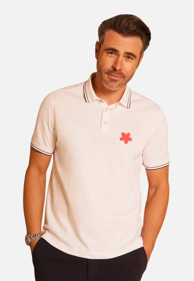 Made in Thailand, this Buki "happy" polo shirt features a "happy" flower motif on the chest. In White.