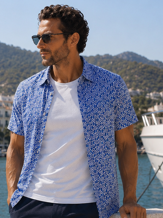 Man at dock wearing Buki Cinqo T in White with field Day tech short sleeve shirt with a scrimage short 