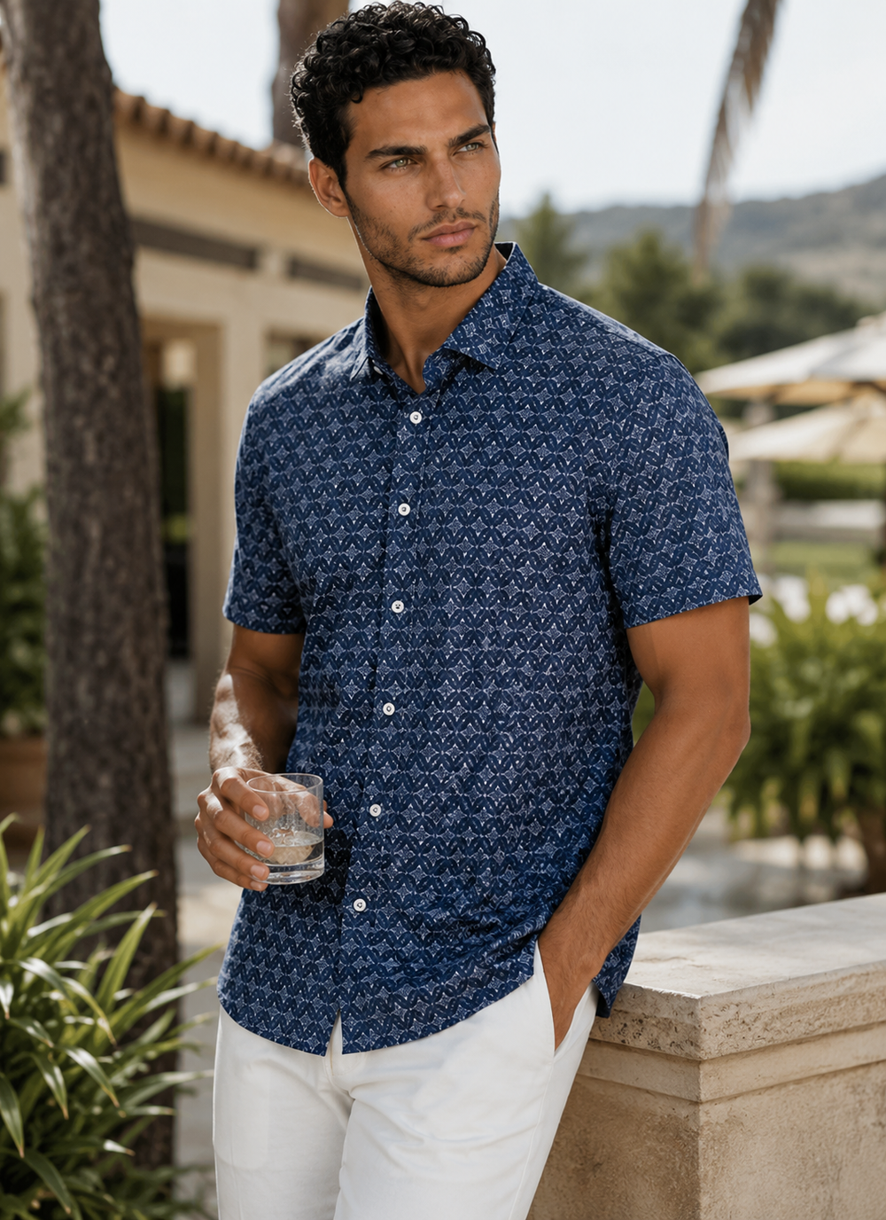 Man wearing a Midnight Star Short Sleeve shirt and Eagle Short standing outdoors.