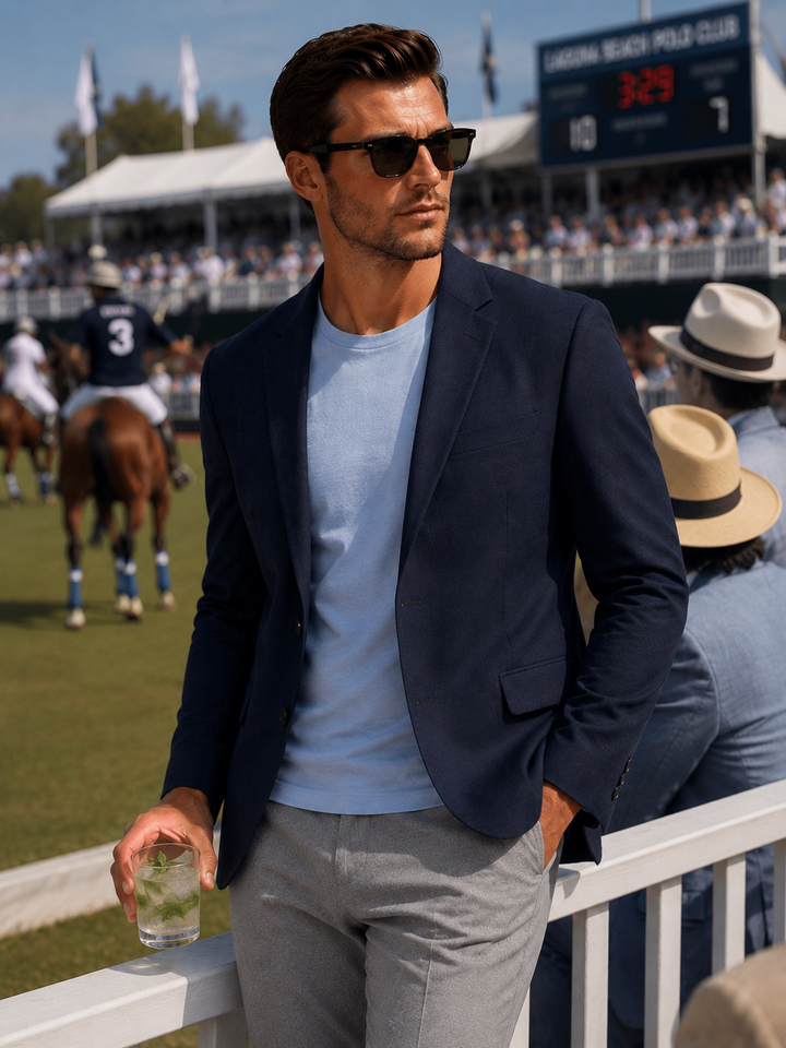 Man in Buki Travel Tech Blazer and french Blue Cinqo t-Shirt with Heather Grey Buki Pnat at a Polo Match