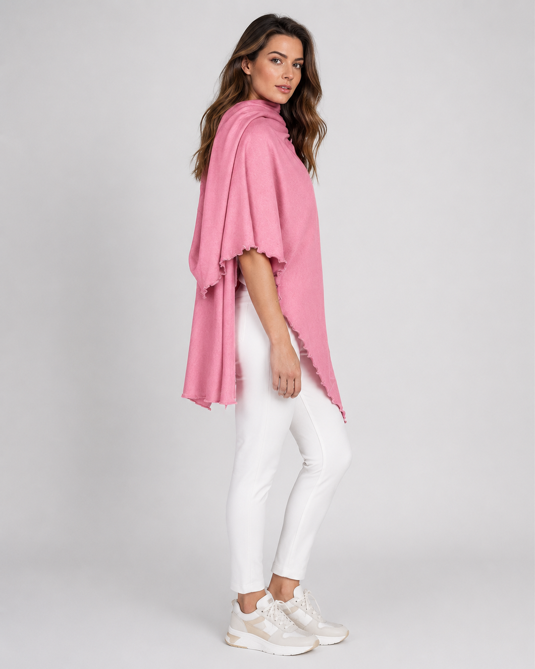 a woman wearing a buki berry pink travel wrap