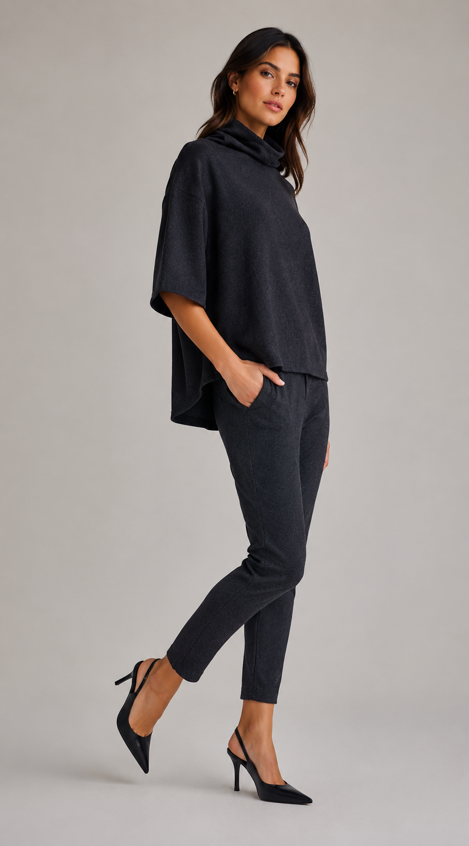 Woman wearing a Perfect Pulloever with a Buki Unisexy Jogger pant on a gray background