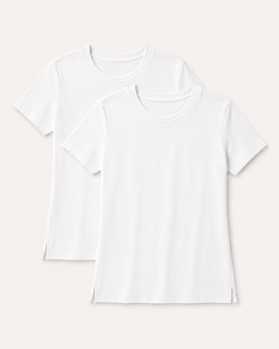 Two Buki Cinqo white short-sleeve crew-neck T-shirts layered on a light warm gray background.