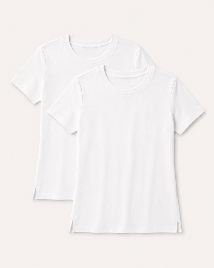 Two Buki Cinqo white short-sleeve crew-neck T-shirts layered on a light warm gray background.